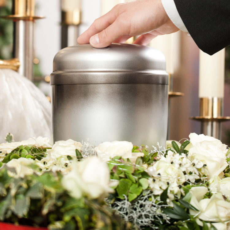 funeral flowers and urn